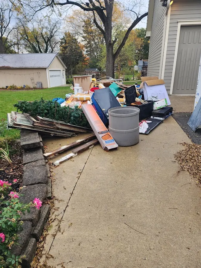 Dumpster being loaded with debris for Commercial Dumpster Rental in Nazareth